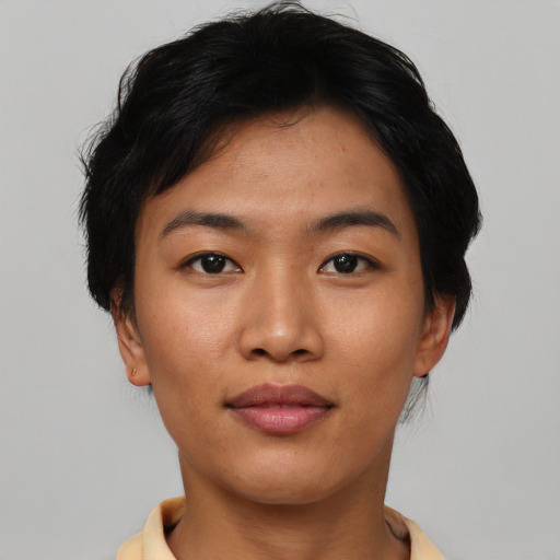 Joyful asian young-adult female with short  brown hair and brown eyes