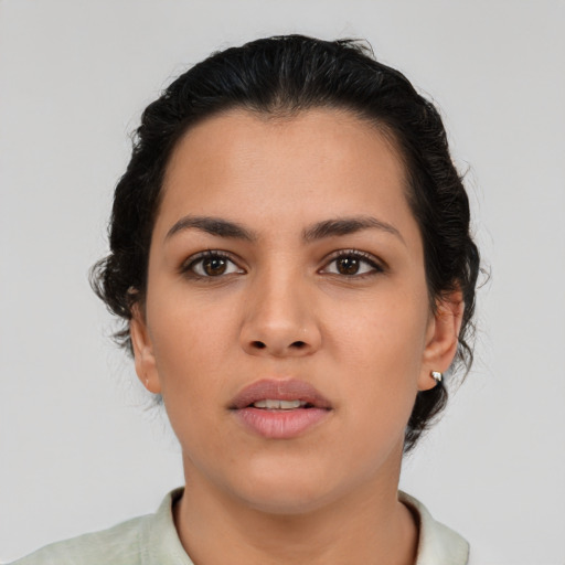 Neutral latino young-adult female with medium  brown hair and brown eyes