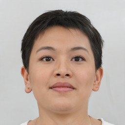 Joyful asian young-adult female with short  brown hair and brown eyes