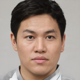 Neutral asian young-adult male with short  brown hair and brown eyes