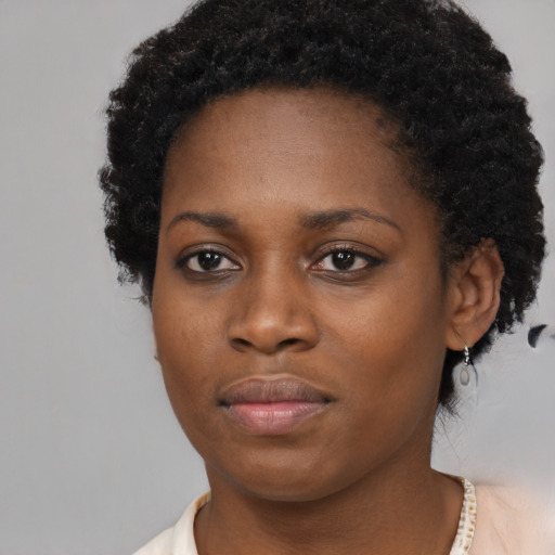 Neutral black young-adult female with short  brown hair and brown eyes