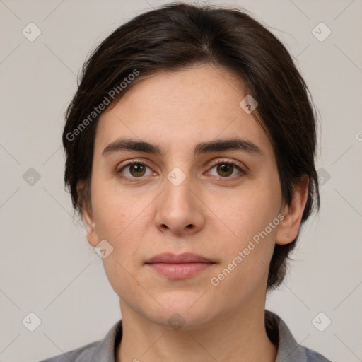 Neutral white young-adult female with medium  brown hair and brown eyes