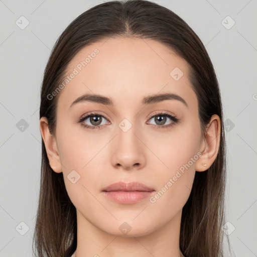 Neutral white young-adult female with long  brown hair and brown eyes