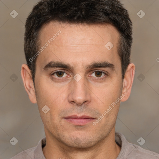 Joyful white adult male with short  brown hair and brown eyes