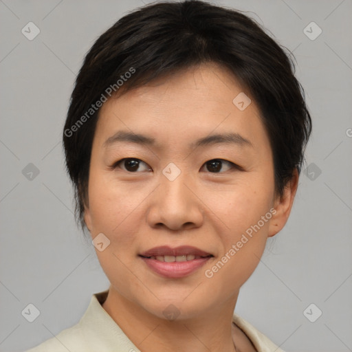 Joyful asian young-adult female with short  brown hair and brown eyes