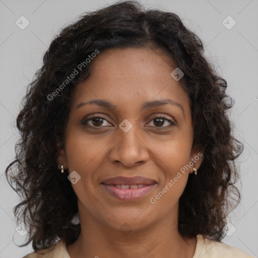 Joyful black young-adult female with long  brown hair and brown eyes