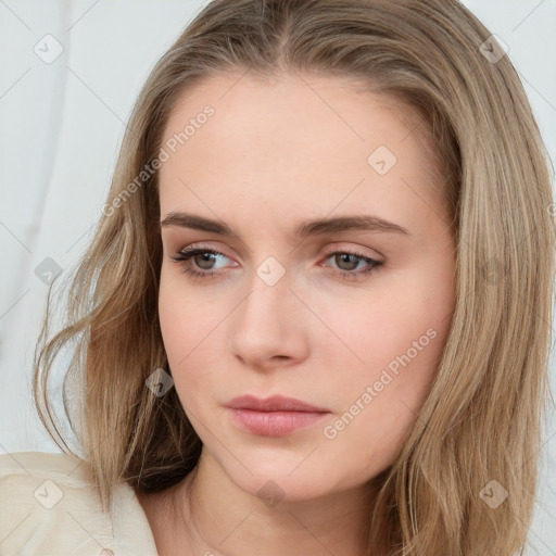 Neutral white young-adult female with long  brown hair and brown eyes