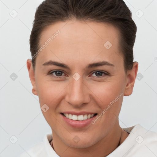 Joyful white young-adult female with short  brown hair and brown eyes