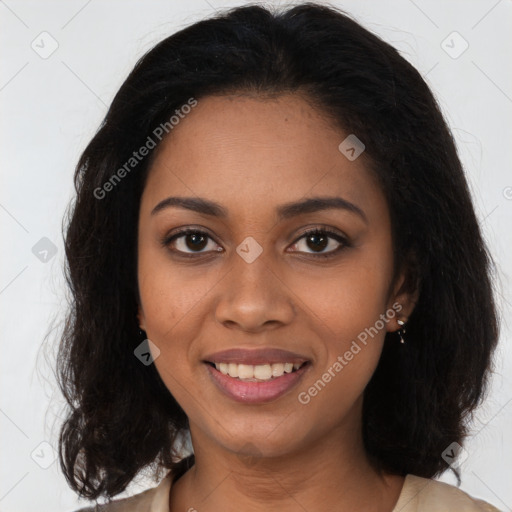 Joyful black young-adult female with long  brown hair and brown eyes