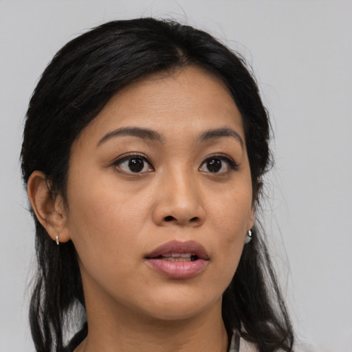 Neutral asian young-adult female with medium  brown hair and brown eyes