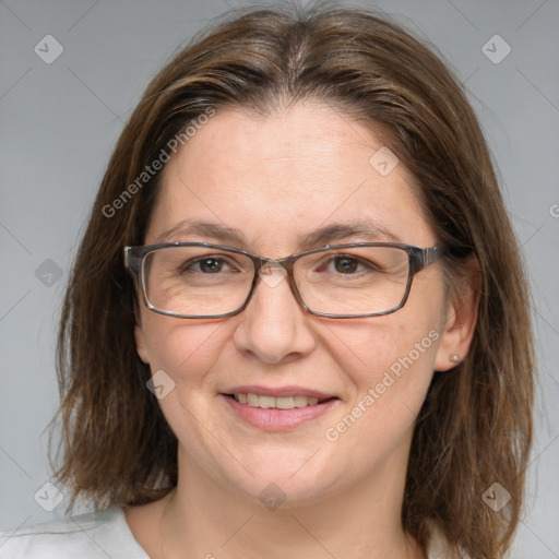 Joyful white adult female with medium  brown hair and grey eyes