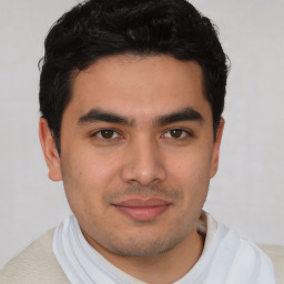 Joyful latino young-adult male with short  brown hair and brown eyes