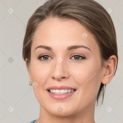 Joyful white young-adult female with medium  brown hair and grey eyes