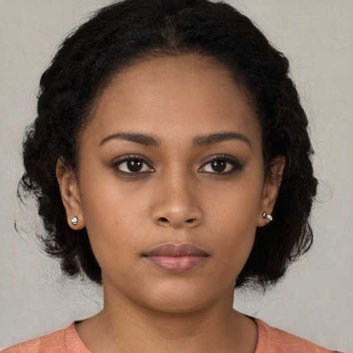Neutral black young-adult female with long  black hair and brown eyes