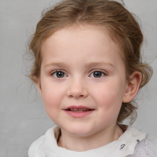 Joyful white child female with medium  brown hair and blue eyes