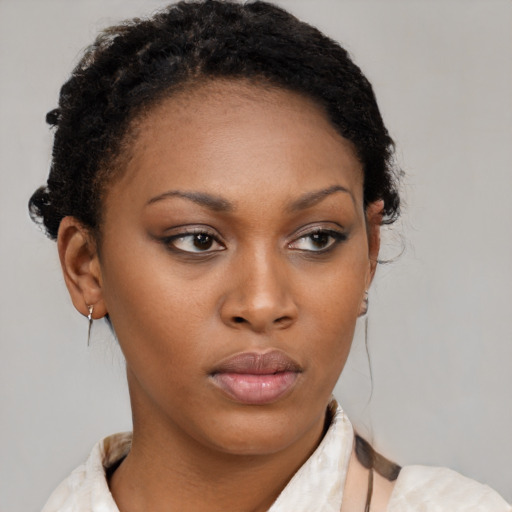 Neutral black young-adult female with short  brown hair and brown eyes