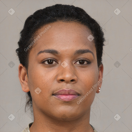 Joyful black young-adult female with short  brown hair and brown eyes
