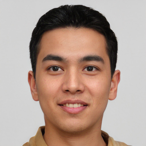 Joyful asian young-adult male with short  black hair and brown eyes