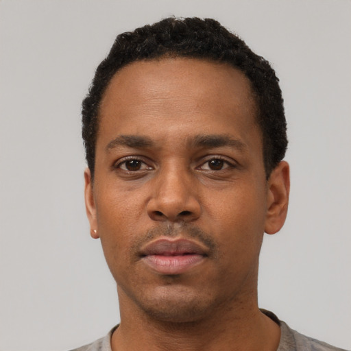 Neutral black young-adult male with short  black hair and brown eyes