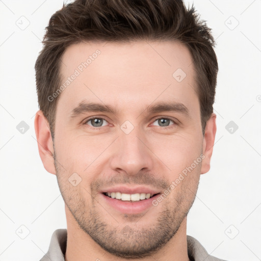 Joyful white young-adult male with short  brown hair and brown eyes