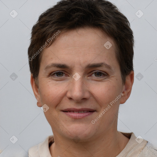 Joyful white adult female with short  brown hair and brown eyes