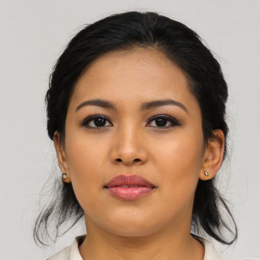 Joyful asian young-adult female with medium  black hair and brown eyes