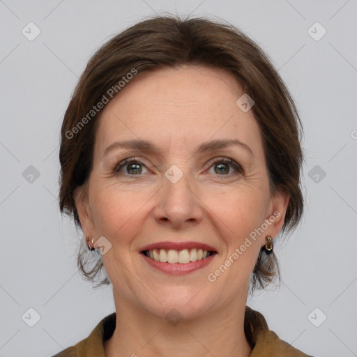 Joyful white adult female with medium  brown hair and grey eyes