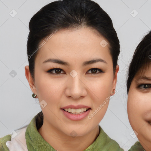 Joyful asian young-adult female with short  brown hair and brown eyes