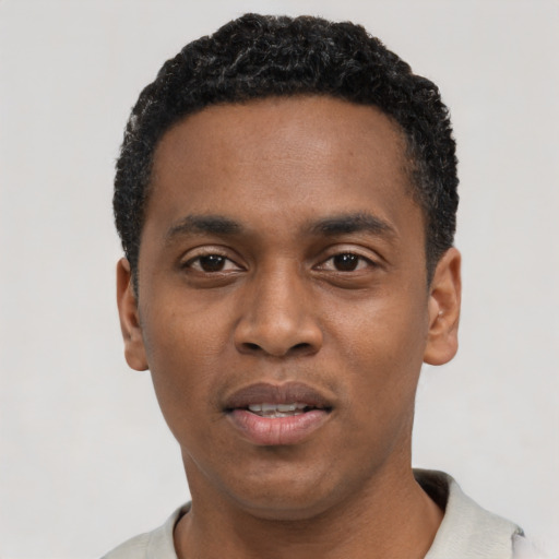Neutral black young-adult male with short  black hair and brown eyes
