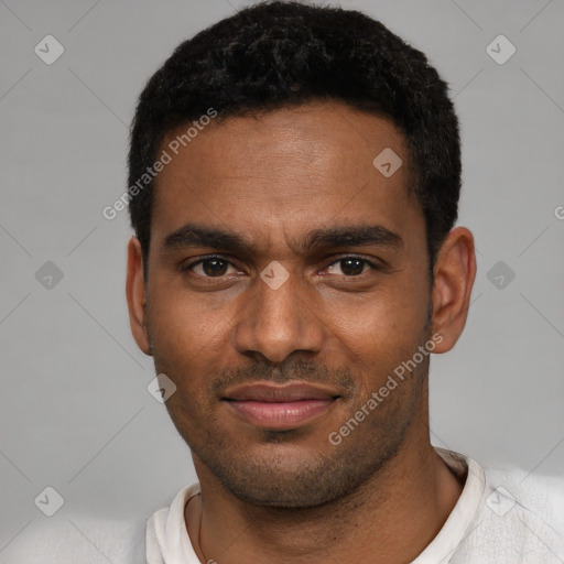 Joyful black young-adult male with short  black hair and brown eyes