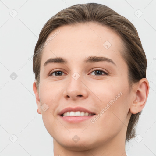 Joyful white young-adult female with short  brown hair and grey eyes