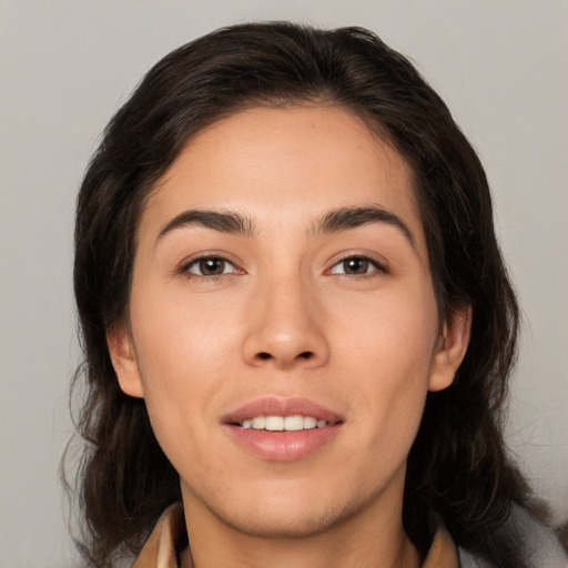 Joyful white young-adult female with medium  brown hair and brown eyes