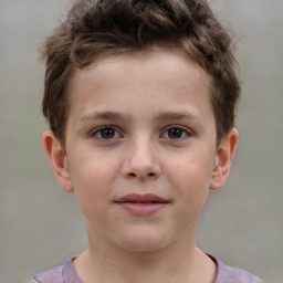 Joyful white child male with short  brown hair and brown eyes