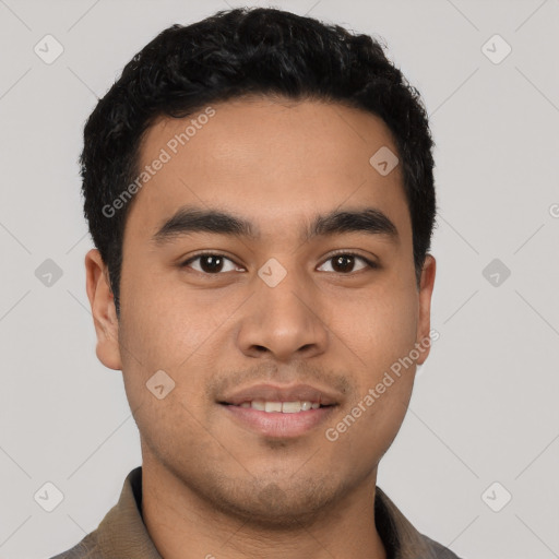 Joyful latino young-adult male with short  black hair and brown eyes