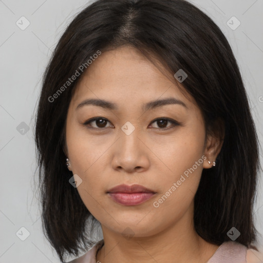 Joyful asian young-adult female with long  brown hair and brown eyes