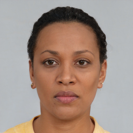 Neutral latino young-adult female with short  black hair and brown eyes