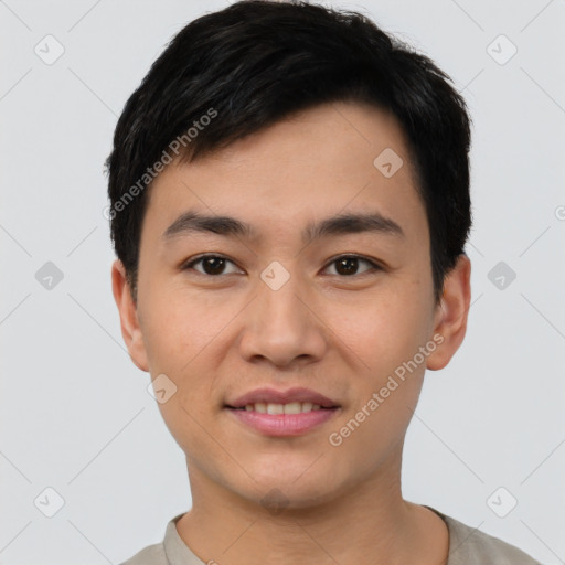 Joyful asian young-adult male with short  black hair and brown eyes