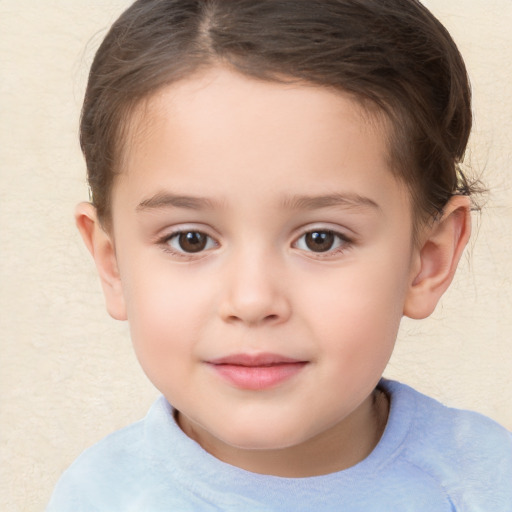 Joyful white child female with short  brown hair and brown eyes