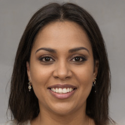 Joyful white young-adult female with long  brown hair and brown eyes