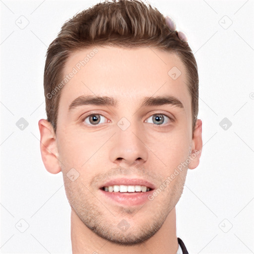 Joyful white young-adult male with short  brown hair and grey eyes