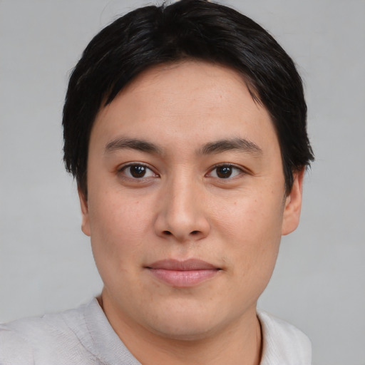 Joyful asian young-adult male with short  brown hair and brown eyes