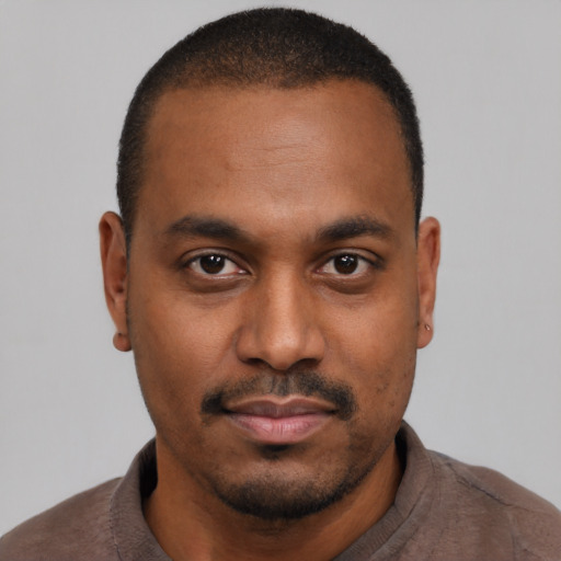 Neutral black young-adult male with short  black hair and brown eyes
