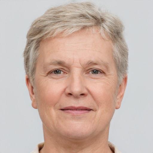 Joyful white middle-aged male with short  gray hair and brown eyes