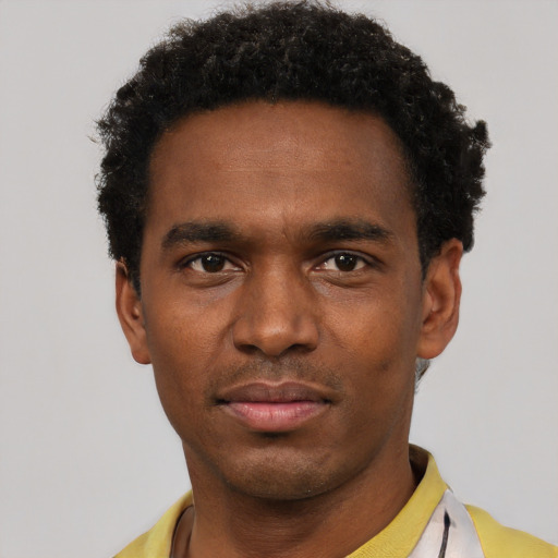 Neutral black young-adult male with short  black hair and brown eyes
