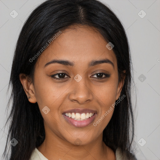 Joyful latino young-adult female with long  brown hair and brown eyes