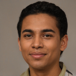 Joyful latino young-adult male with short  brown hair and brown eyes