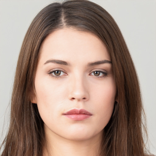 Neutral white young-adult female with long  brown hair and brown eyes