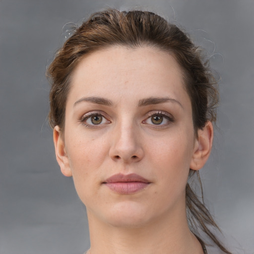 Neutral white young-adult female with short  brown hair and brown eyes