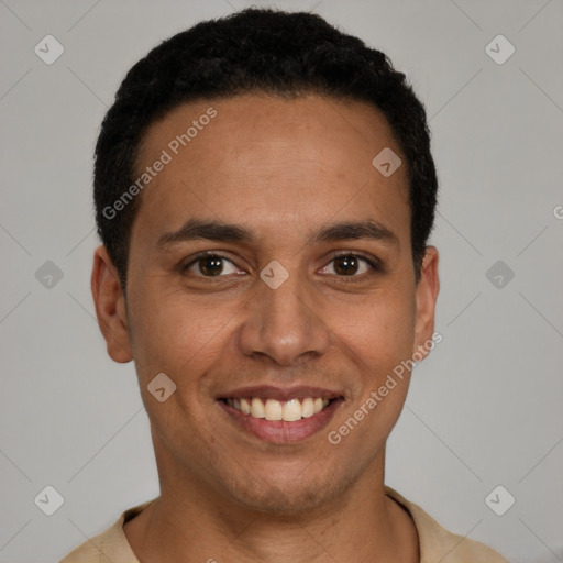 Joyful latino young-adult male with short  black hair and brown eyes