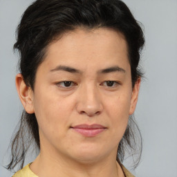 Joyful asian young-adult female with medium  brown hair and brown eyes